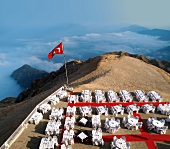 Turkish Flag and laid tables on Taurus Mountains in Olympos National Park, Antalya, Turkey