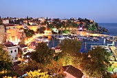 Boats moored in Old Town harbour at night in Antalya, Turkey