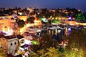 Boats moored in Old Town harbour at night in Antalya, Turkey