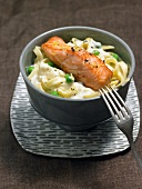 Tagliatelle with salmon in bowl