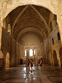 Three tourist in St. Nicholas Church, Demre, Turkey