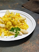 Close-up of saffron risotto with asparagus on plate