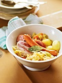 Alsatian meat with sauerkraut in bowl