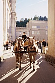 Fiaker and people at Cathedral Square, Salzburg, Austria