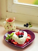 Cream cheese with fruit sauce on heart shaped plate, France