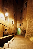 Steps descending towards stone alley in Capuchin Monastery, Salzburg, Austria
