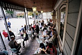 People sitting at Tomaselli cafe in Salzburg, Austria