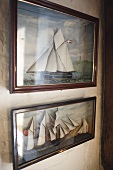 Images of sailing ships hanging on wall