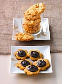 Peanut cookies in glass and mocha cookies on plate