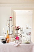 Wedding table with gifts, crockery and flower pot