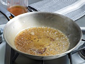 Pan drippings being boiled in frying pan, step 3