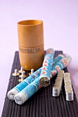 Close-up of cone incense sticks and moxibustion on mat