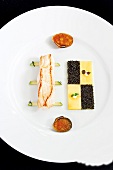 Turbot with potatoes and caviar on plate