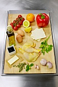 Ingredients for baeckeoffe with guinea fowl on wooden board