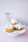 Three mini cakes decorated with icing sugar