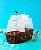 Pirate ship cake on blue background