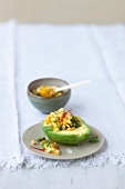 Avocado with Caribbean pineapple and ginger salsa on plate