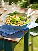 Linguine with green beans and pesto in bowl, garden kitchen