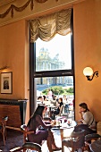 Guest sitting in cafe Kazalisna Kavana at Zagreb, Croatia