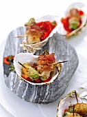 Oyster snack with sweet pepper strawberry salad in serving dish