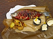 Loup de Mer with lemon and butter, overhead view