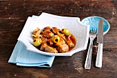 Lamb stew with olives in bowl