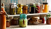 Preserved foods in jars on shelf