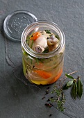 Chicken with vegetables and broth in jar