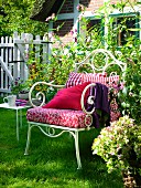 Metal armchair and side table in garden