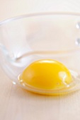 Close-up of egg yolk in glass bowl 