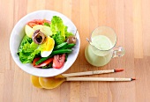 Salad nicoise with avocado dressing in bowl