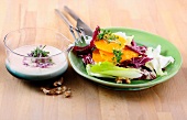 Winter salad with mascarpone cheese dressing on plate