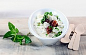 Feta and mint dip with cranberries in bowl