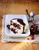 Coconut parfait with cranberries and ginger and chocolate sauce