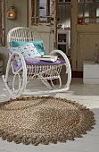 Mottled carpet with crocheted border from rope and white chair