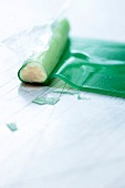 Close-up of jelly rolls with asparagus and cream