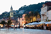 People at Hvar old town at twilight in Croatia