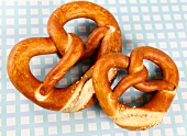 Two pretzels on blue checked napkin