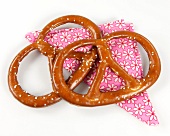 Two pretzels on floral pattern napkin