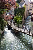 Boy standing on bridge in Augsburg, Bavaria, Germany