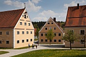 People walking beside perennials monastery at Augsburg, Bavaria, Germany