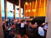 People dining at Skyline Bar 20up in Empire Riverside Hotel, Germany