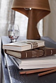 Close-up of leather books, pencils and diaries on table