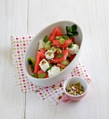 Watermelon salad with feta cheese in serving dish