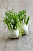 Close-up of fennel bulbs on wooden surface