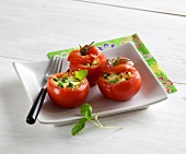 Stuffed tomatoes with mozzarella in serving dish