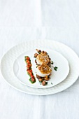 Close-up of fried scallops with chanterelles and red pepper on plate