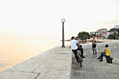 Teens on promenade near beach Makarska, Croatia