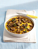 Polenta slices with mushrooms in serving dish
