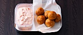 Falafel with yogurt and tomato dip on plate